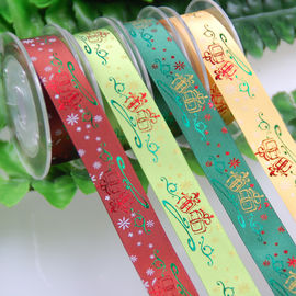 ポリエステルはDecoを包むクリスマスのギフトのためのホイルによって印刷されたリボンを予約しました。